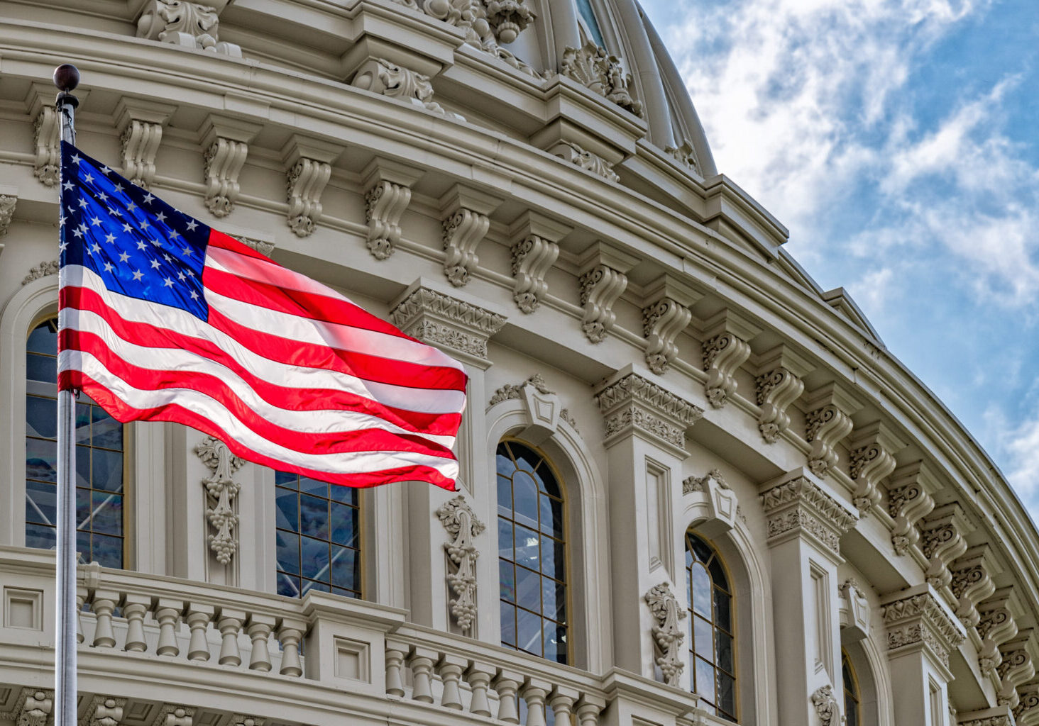 Washington,Dc,Capitol,Dome,Detail,With,Waving,American,Flag